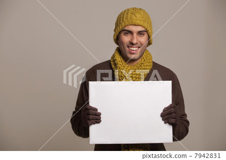 Portrait of young man holding bill board 7942831