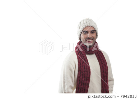 Portrait of young man in warm clothes smiling 7942833