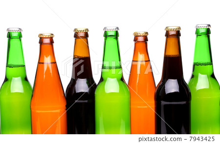 A row of top beer bottles 7943425