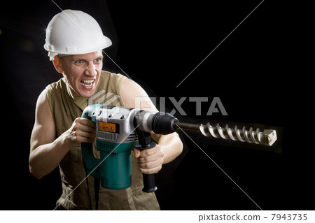The builder in a protective helmet The builder in a protective helmet 7943735