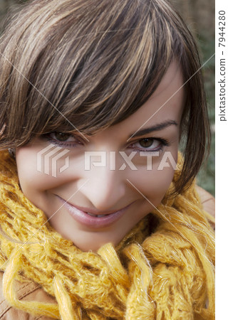 Smiley brunette with yellow scarf 7944280