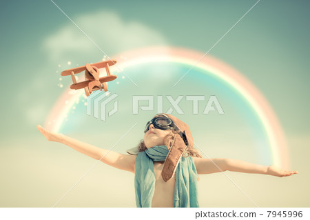 Happy kid playing with toy airplane 7945996