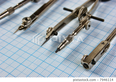 Old drawing tools on graph paper 7946114