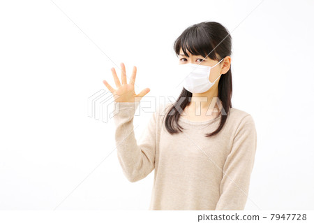 A woman showing her number with her finger A woman showing her number with her finger 7947728