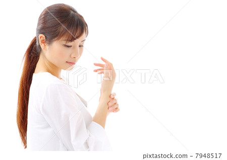 Women touching the wrist Women touching the wrist 7948517