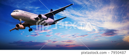Jet aircraft in a sunset sky. Panoramic composition. Jet aircraft in a sunset sky. Panoramic composition. 7950487