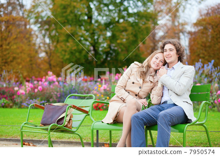 Romantic couple in a park, having a date Romantic couple in a park, having a date 7950574