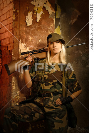 Beautiful woman soldier with a sniper rifle 7954318