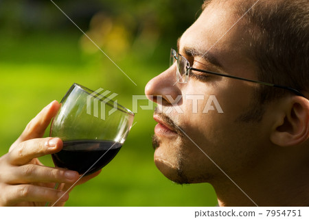 Professional sommelier tasting red wine. Close-up portrait. Professional sommelier tasting red wine. Close-up portrait. 7954751