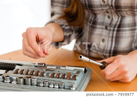 Woman with toolbox and screwdriver Woman with toolbox and screwdriver 7959977