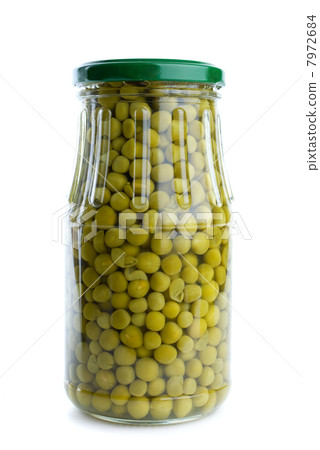 Glass jar with conserved green peas Glass jar with conserved green peas 7972684