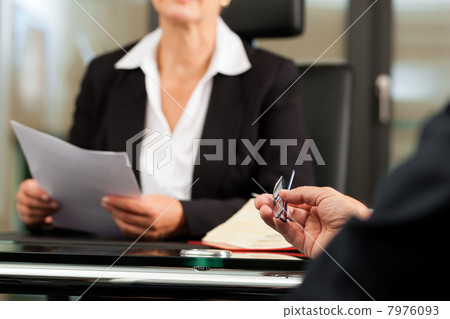 Female Lawyer or notary in her office 7976093