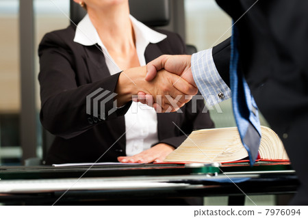 Female Lawyer or notary in her office 7976094