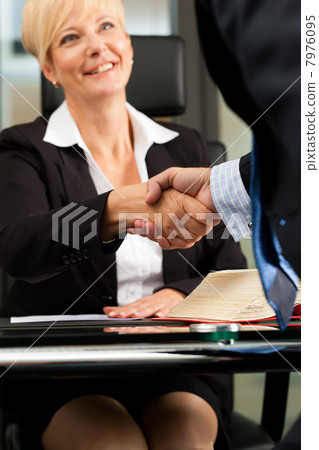 Female Lawyer or notary in her office 7976095