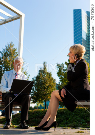 Business people working outdoors Business people working outdoors 7976569