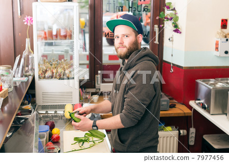 Fast food chef making hotdog in snack bar 7977456
