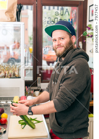Fast food chef making hotdog in snack bar 7977457