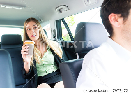 Woman traveling in taxi, she has an appointment 7977472