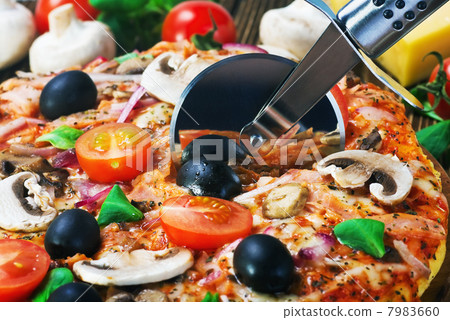 cutter cuts a fresh pizza with mushrooms and cheese cutter cuts a fresh pizza with mushrooms and cheese 7983660