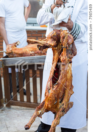 Roasted whole lamb, prepared in earth oven 7985489