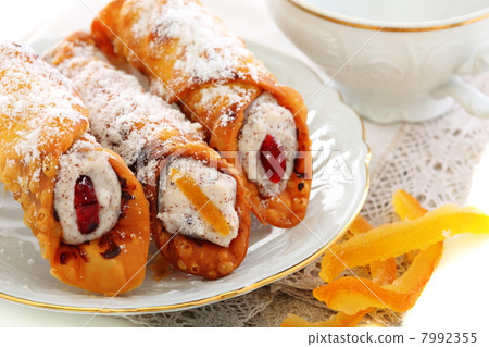 Cannoli with fresh ricotta and candied fruit. 7992355