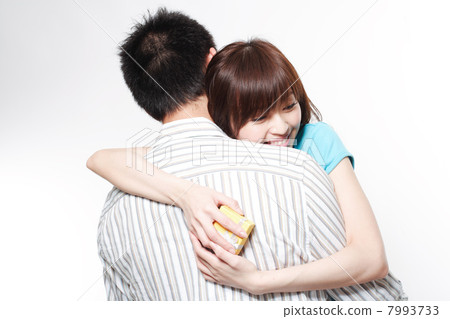 Portrait of a young couple embracing 7993733