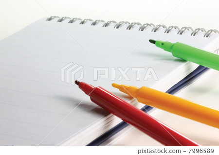 Felt tip pens on a notebook Felt tip pens on a notebook 7996589