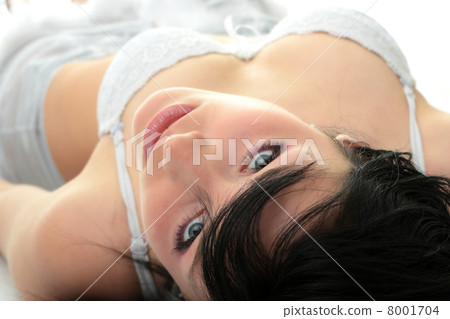 Close-up of beautiful happy woman on the bed. Close-up of beautiful happy woman on the bed. 8001704