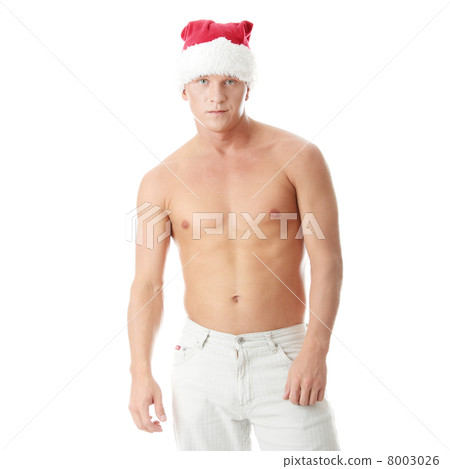 Sexy muscular man wearing a Santa Claus hat Sexy muscular man wearing a Santa Claus hat 8003026