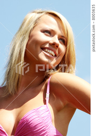 Young blond woman in bikini outdoors 8003635