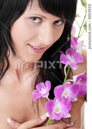 Beautiful Caucasian woman and orchid 8003658