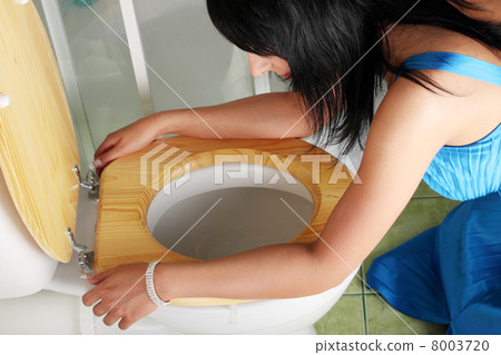 Young caucasian woman in toilet Young caucasian woman in toilet 8003720