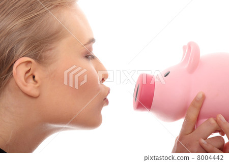 Businesswoman holding piggy bank 8004442
