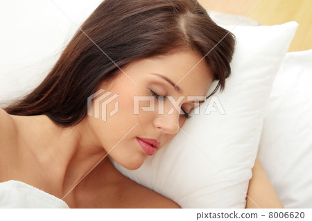 Young woman sleeping on the bed Young woman sleeping on the bed 8006620