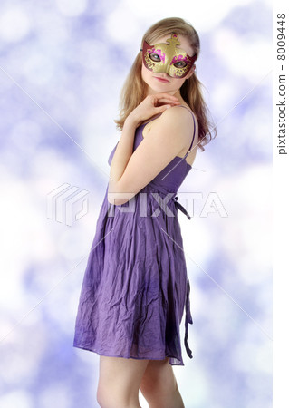Young woman wearing carnival mask 8009448