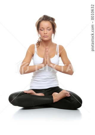 Woman doing yoga 8010632