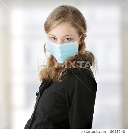 A model wearing a mask to prevent Swine Flu infection. A model wearing a mask to prevent Swine Flu infection. 8011140