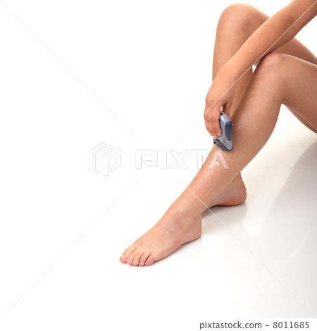 Woman depilating her leg. 8011685