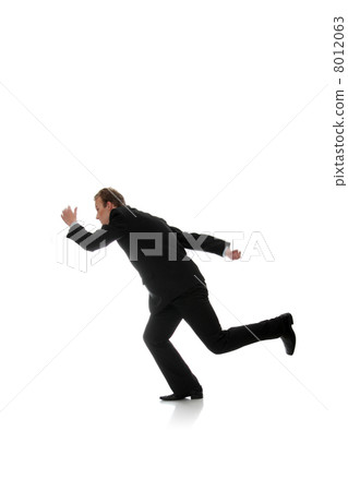 Attractive athletic businessman running Attractive athletic businessman running 8012063