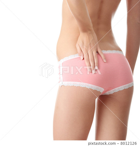 Young woman with hand on her buttock 8012126