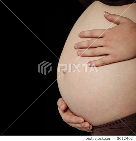 Belly of a pregnant woman 8012402