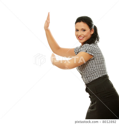Businesswoman pushing something imaginary Businesswoman pushing something imaginary 8012892