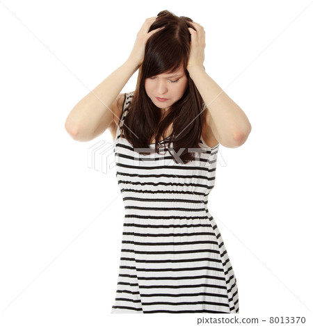 Woman with headache holding her hand to the head. 8013370
