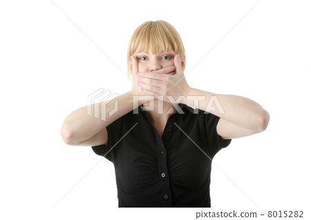 Young woman covering her mouth Young woman covering her mouth 8015282