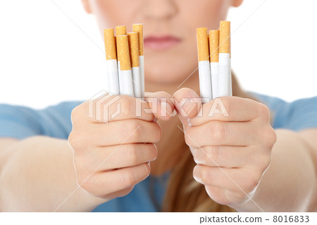 Young caucasian woman quiting smoking Young caucasian woman quiting smoking 8016833