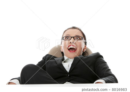 Young businesswoman relaxing at the desk 8016983