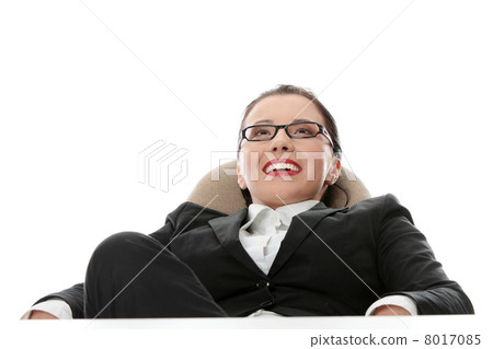 Young businesswoman relaxing at the desk 8017085