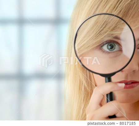 Teen girl with magnifier Teen girl with magnifier 8017185