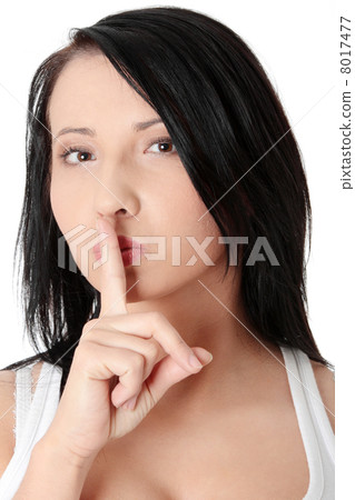 Young woman gesturing for quiet Young woman gesturing for quiet 8017477