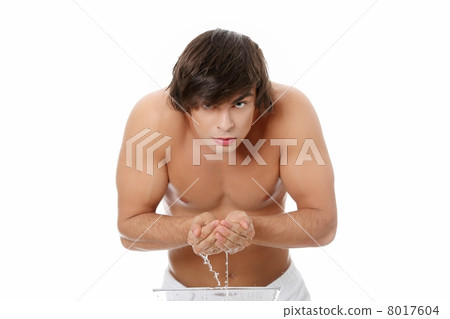 Young handsome man washing his face Young handsome man washing his face 8017604